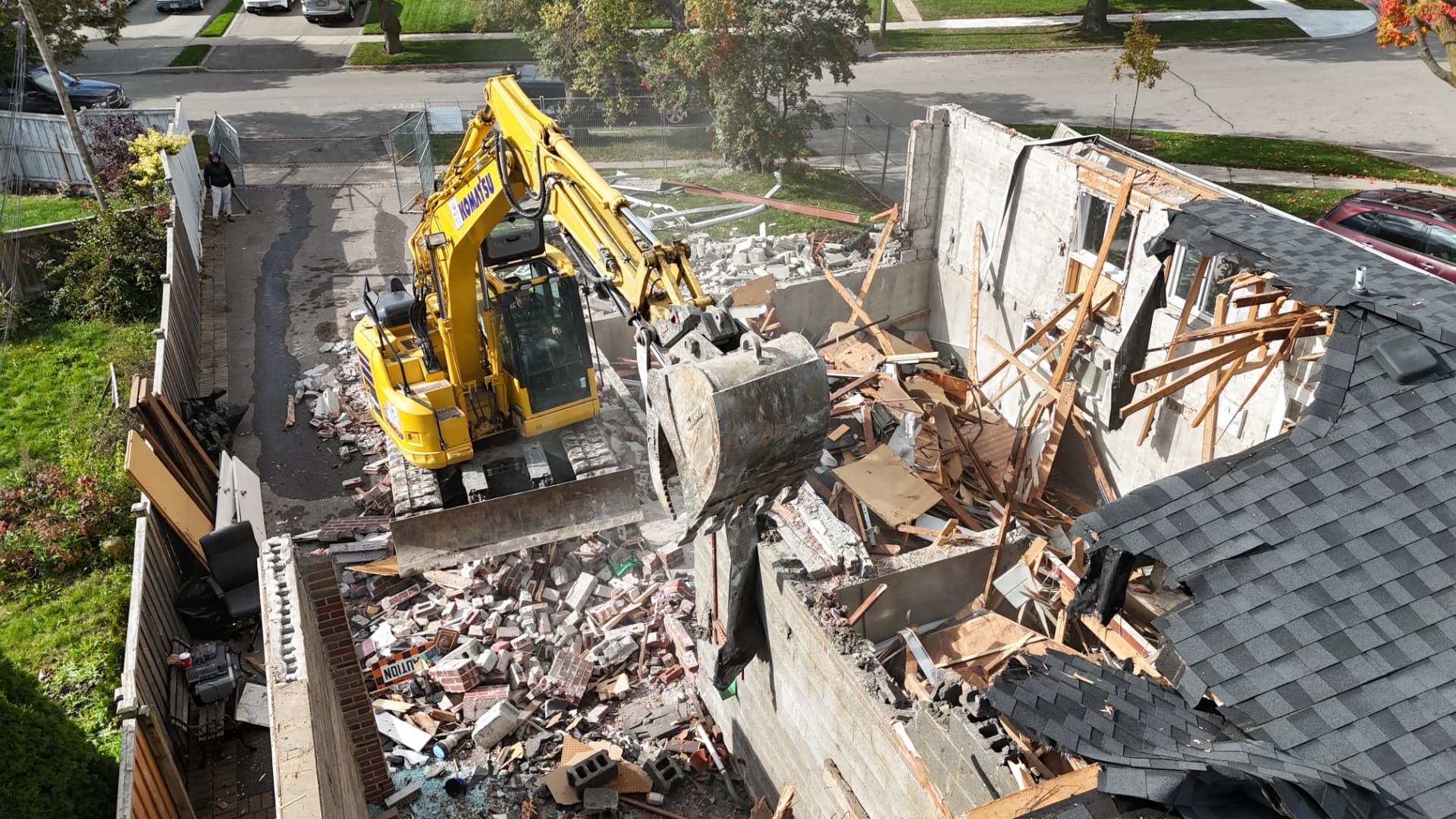 Pinemar excavator demolishing a house, seen from above
